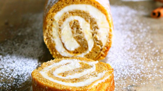 My pumpkin roll recipe is filled with cream cheese giving it an even richer taste! This is one of my favorite pumpkin recipes! #pumpkinrecipe #fallrecipe #pumpkinroll #autumn #frugalnavywife | Pumpkin Recipes | Fall Recipes | Dessert Recipes | Autumn Recipes