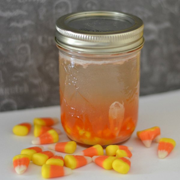 This candy corn infused vodka recipe seems to be quite popular this fall and it's so easy! Just 2 ingredients for the perfect Fall Party drink. #vodka #candycorn #cocktail #infusedvodka #frugalnavywife | Vodka Drinks | Candy Corn Recipes | Infused Vodka Drinks | Cocktails for Fall