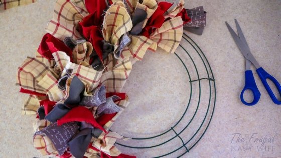 Let me show you how to do this super simple Farmhouse Rag Wreath DIY. This is home decor at its finest and it won't cost you an arm and a leg. #diy #ragwreath #wreathdiy #frugalnavywife | Wreath Crafts | DIY Wreaths | Farmhouse Decor | Farmhouse Wreath | Home Decor | Wreaths