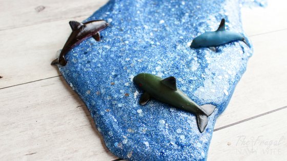 We made this Ocean Slime at the request of my son and they had a blast with it! Borax Free so it's totally safe for the kids. #slime #dolphins #oceanslime #homeschool #frugalnavywife | Slime Recipes | Homeschooling Activities | Dolphins Themed Activities | Ocean Themed Activities
