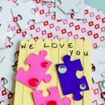 Homemade Valentine's for family and friends can be as easy as Popsicle Sticks and Puzzle Pieces. Let the kids make this DIY Valentine's from Popsicle Sticks this year! #thefrugalnavywife #popsiclestickcrafts #puzzlepiececrafts #kidsdiy #easykidscrafts | Easy Crafts for Kids | Valentine's Day Gift Ideas | Homemade Valentine's for Kids | Puzzle Piece Crafts | Easy DIY | Popsicle Stick Crafts